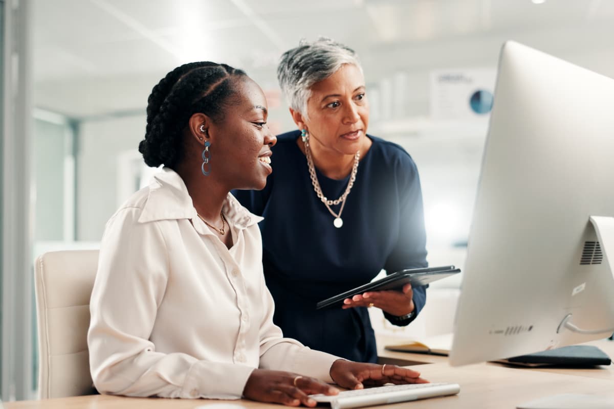 Computer, teamwork and review with business women in office for accounting discussion, audit feedback or talk. Tech, portfolio manager and collaboration with mentor, tablet and finance agency report