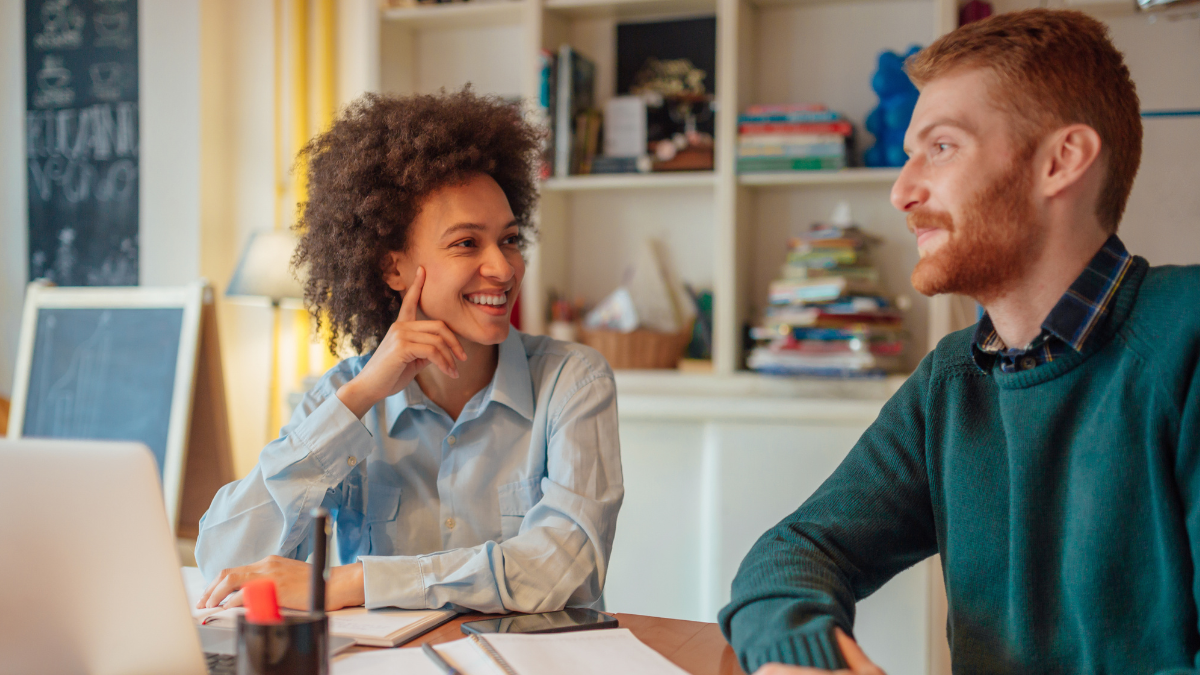 Two colleagues smiling together