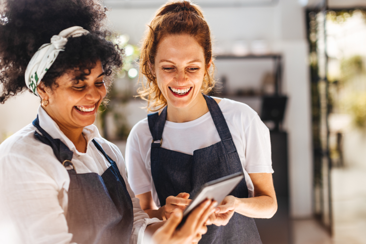 Two hospitality staff members working together