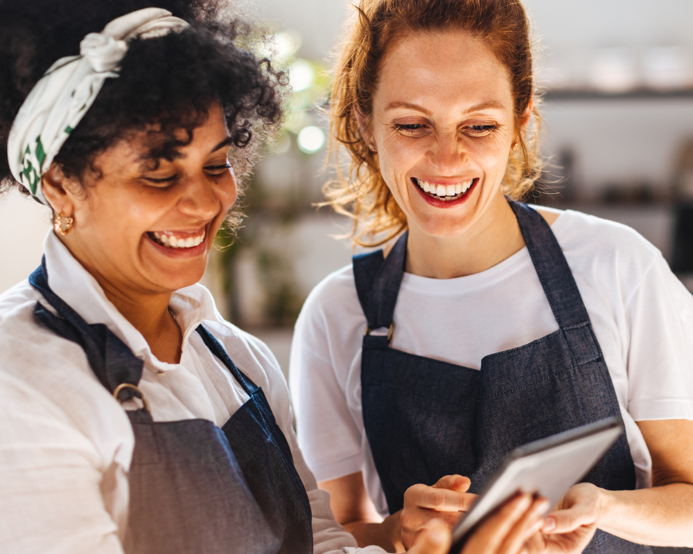 Two hospitality staff members working together